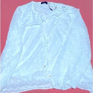 Lovely Tahari long sleeve patterned white blouse with lining.